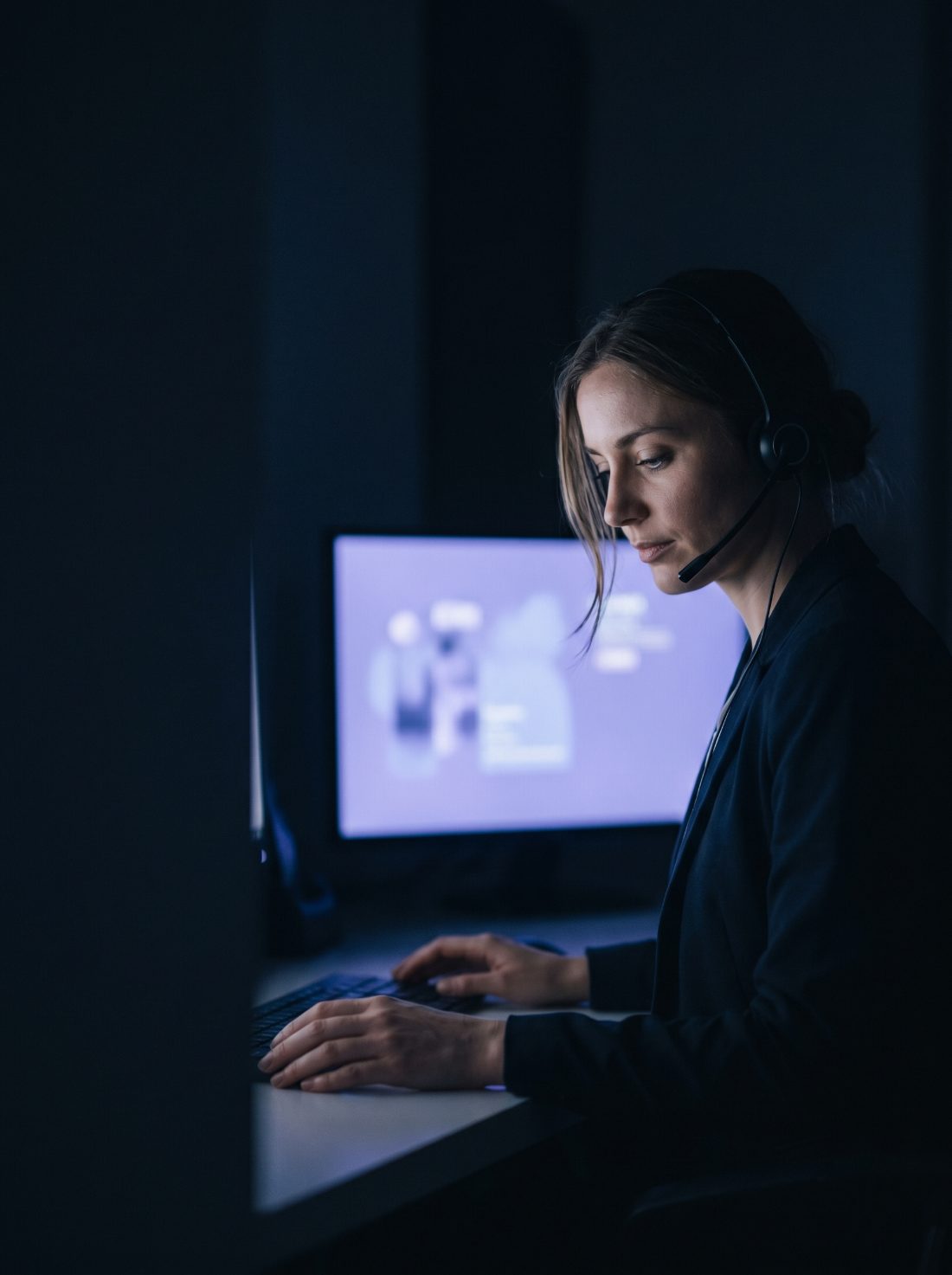 Two agents coordinating at night in a dim office